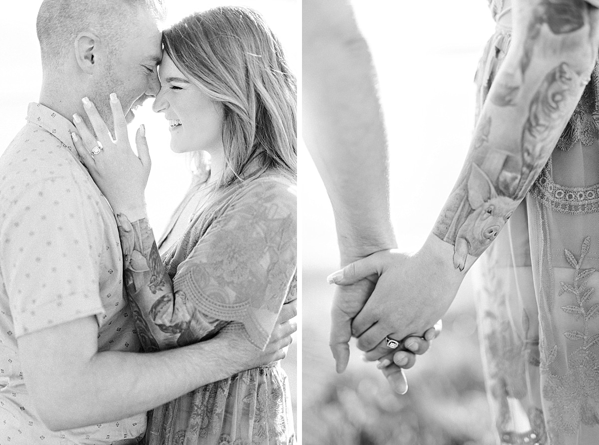 black and white image of engaged couple with tattoos