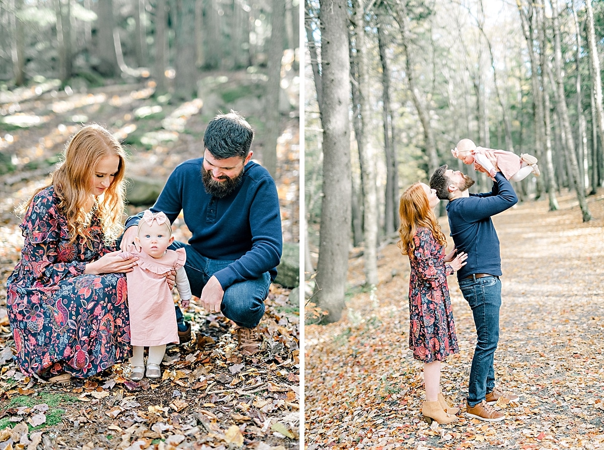 young family teach baby girl how to walk in the forest on the fallen leaves